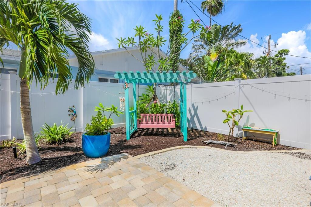 Fenced backyard with a patio area