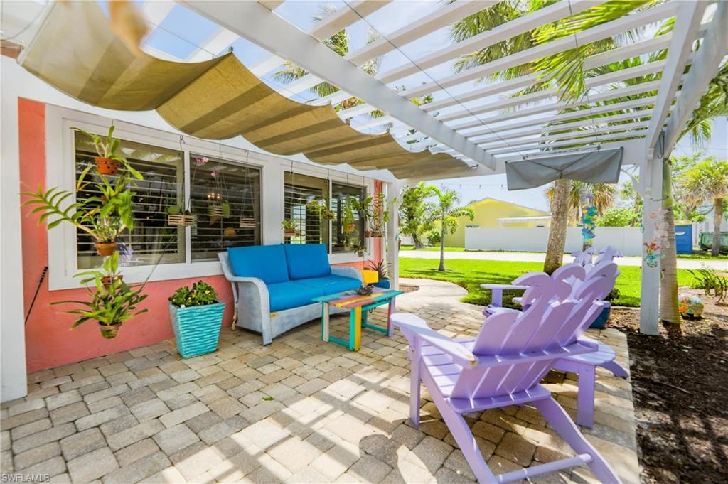 View of patio / terrace featuring a pergola and an outdoor hangout area