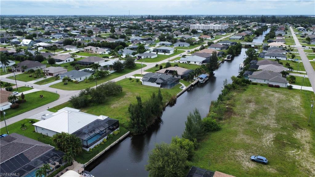 View of property location with nearby suburban area and a nearby body of water