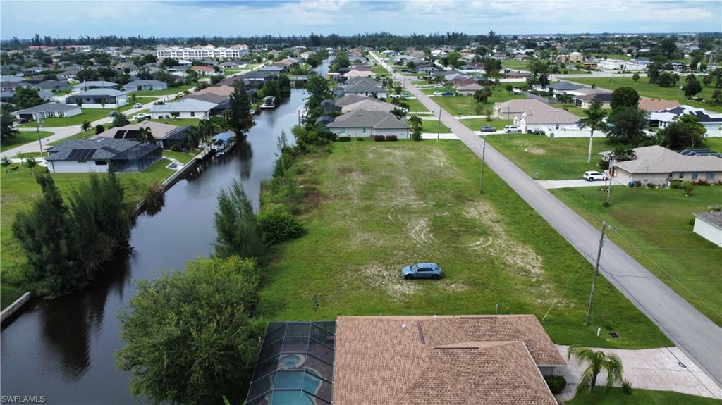 Aerial view of residential area with a large body of water