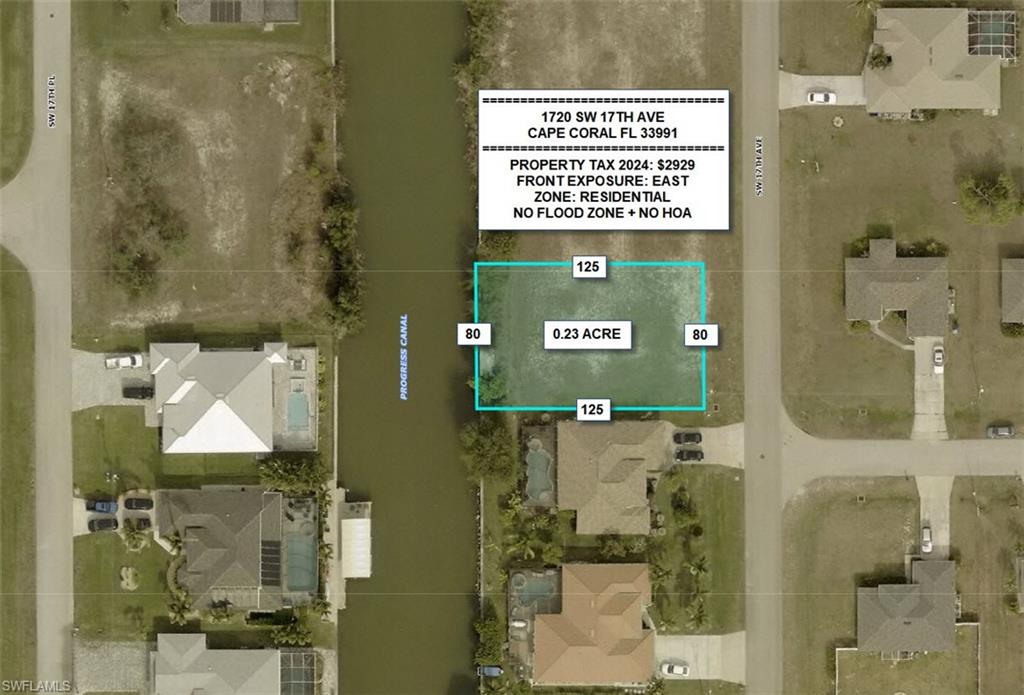 Aerial view of residential area featuring property parcel outlined and a nearby body of water