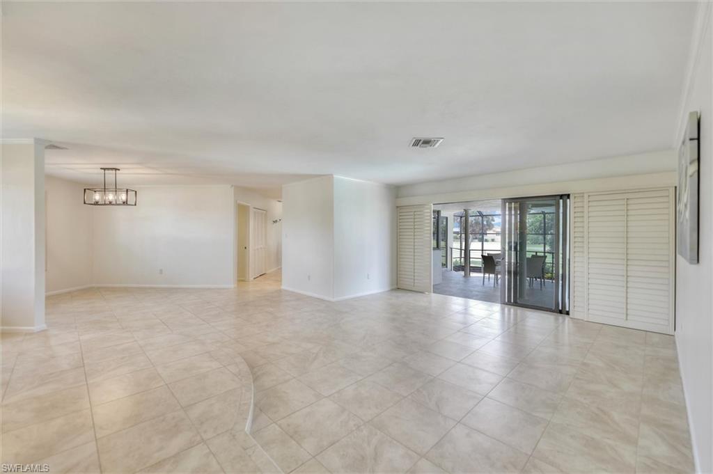 Bedroom featuring light tile patterned floors and ceiling fan