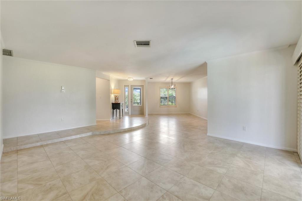 Bathroom with double vanity, tile patterned flooring, and recessed lighting