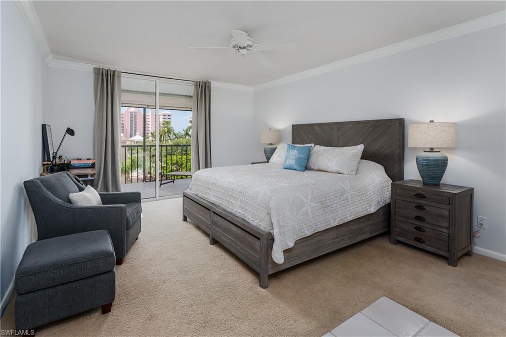 Bedroom with access to outside, light carpet, and a ceiling fan