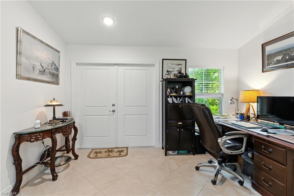 Home office featuring light tile patterned floors