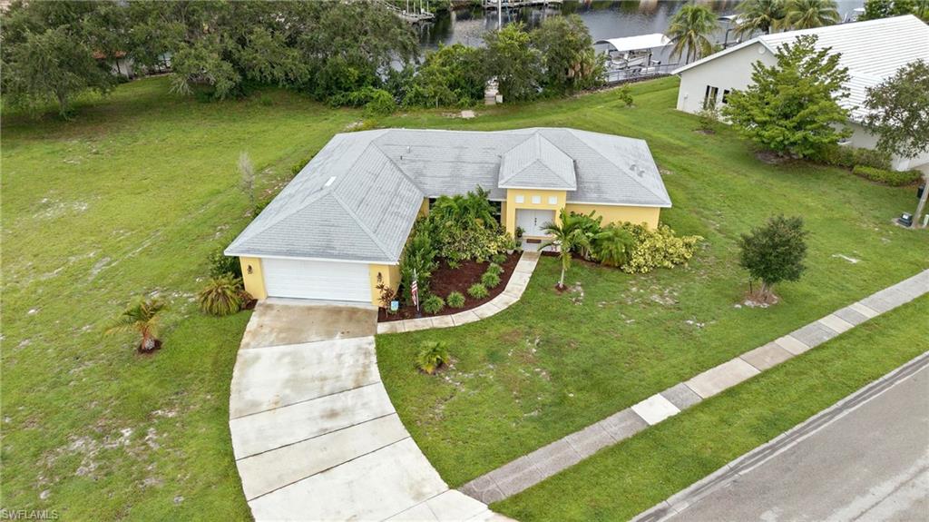 View from above of property with a nearby body of water