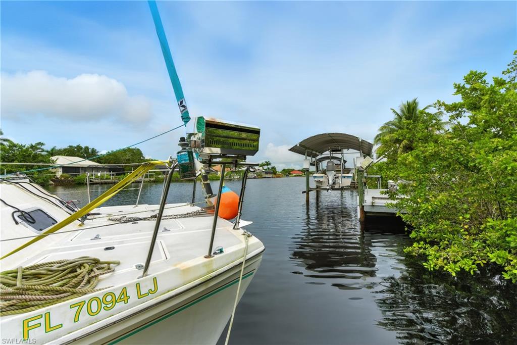 Dock with a water view and boat lift
