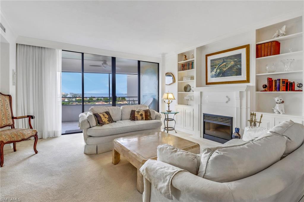 Living room featuring light carpet and built in features