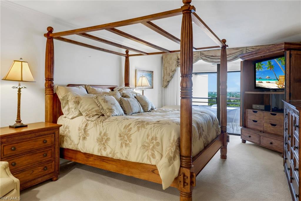 Carpeted bedroom featuring access to outside