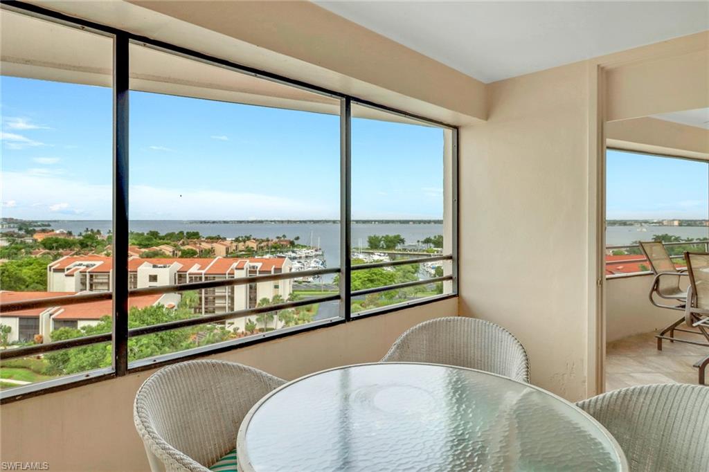 Sunroom with a water view