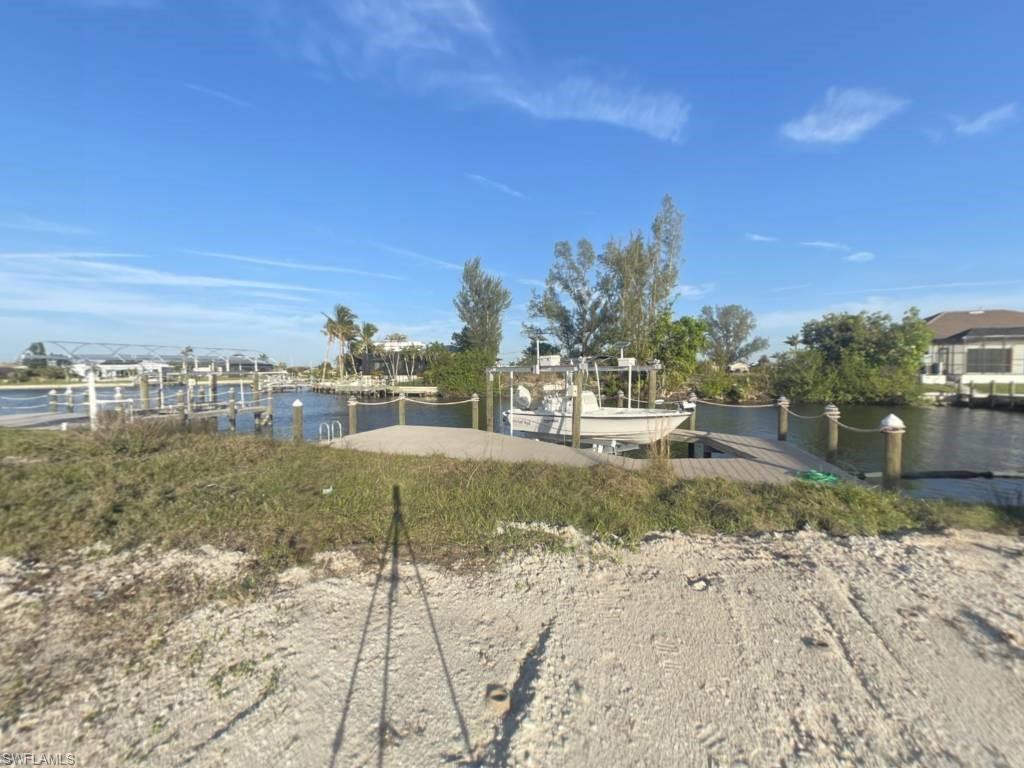 Gulf Access lot with seawall, boat dock and lift northeastern rear exposure, about 20 min by boat to open water. 907 NW 38th Ave, Cape Coral FL 33993