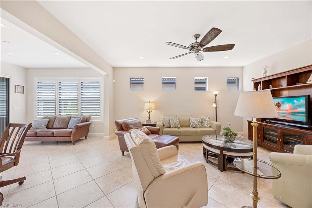 Living Room, manual hurricane shutters on all the windows!