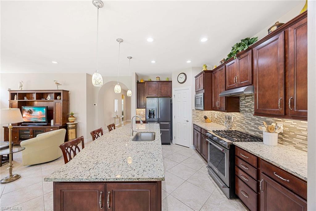 Rich Cabinetry w/ plenty of storage, natural gas range.