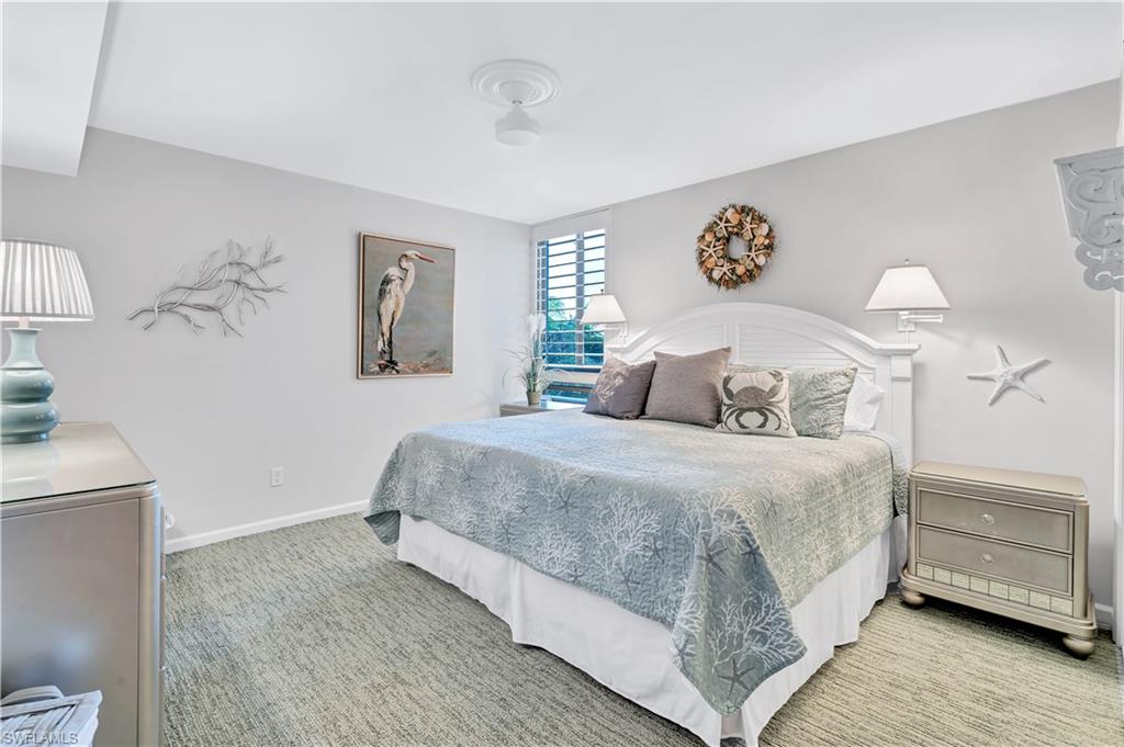 Guest Bedroom with light carpet and baseboards