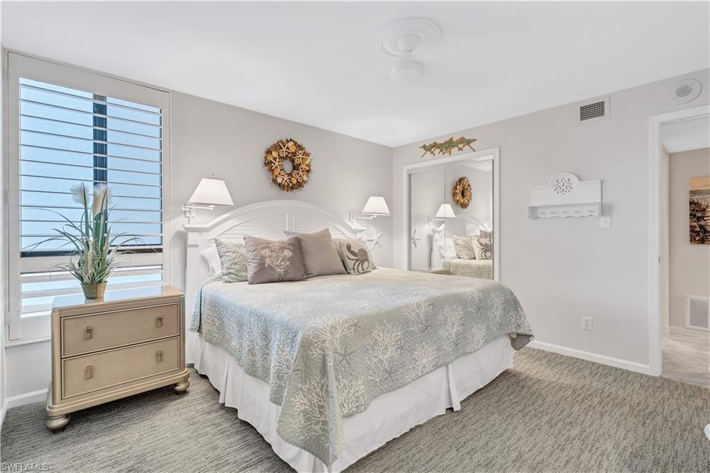 Guest Bedroom featuring carpet flooring and baseboards