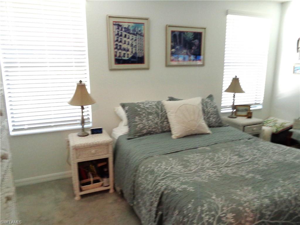 Primary Bedroom with carpet and baseboards