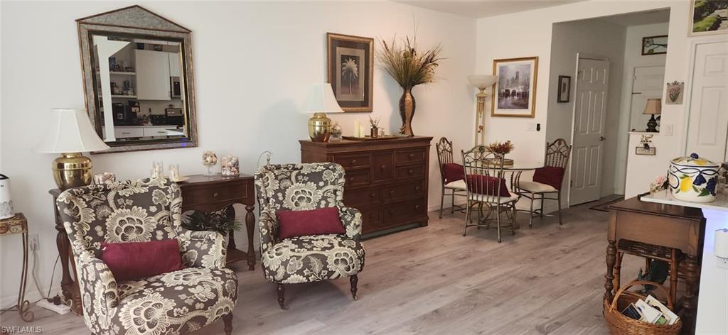 Living area with light wood-style floors