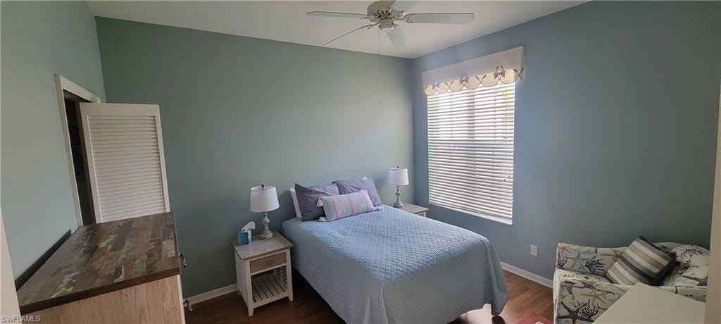 Spacious second bedroom featuring a ceiling fan.