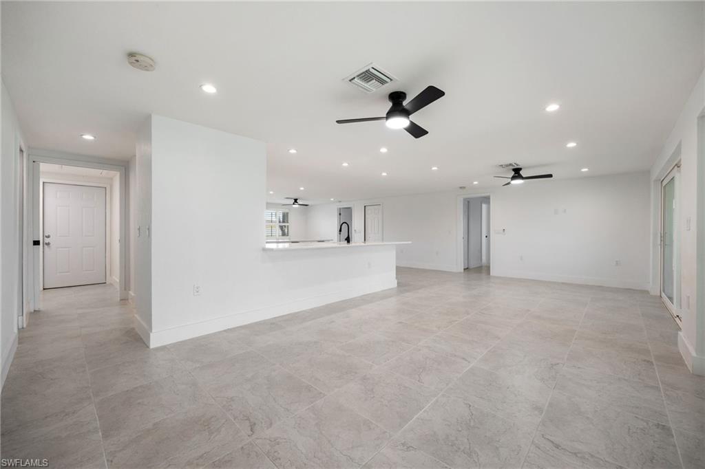 Living room featuring recessed lighting and ceiling fan