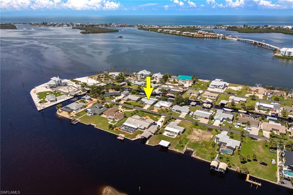 View of property location with a nearby body of water, nearby suburban area, and a notable bridge
