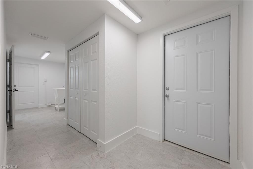 Laundry area with access to both the garage and exterior of the home