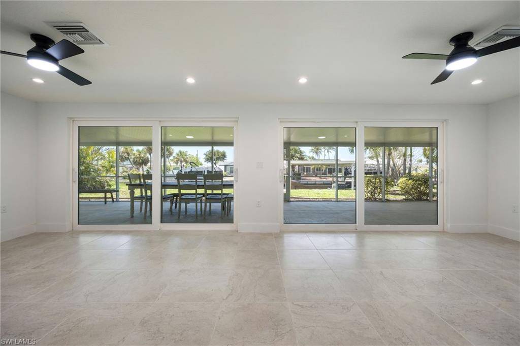Unfurnished room with a ceiling fan and recessed lighting