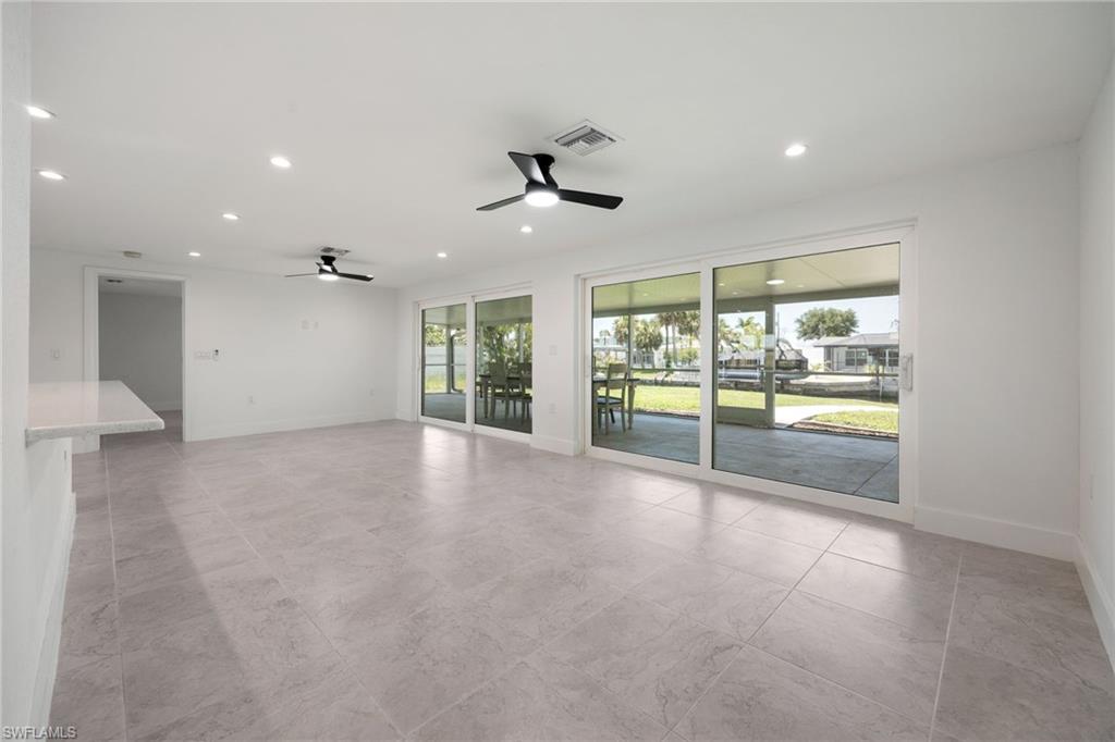 Unfurnished room with plenty of natural light, recessed lighting, ceiling fan, and a sunroom