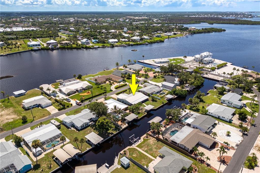 Aerial view of residential area featuring a large body of water