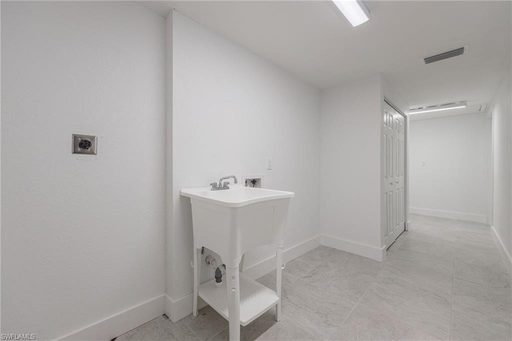 Laundry room with washer hookup and electric dryer hookup
