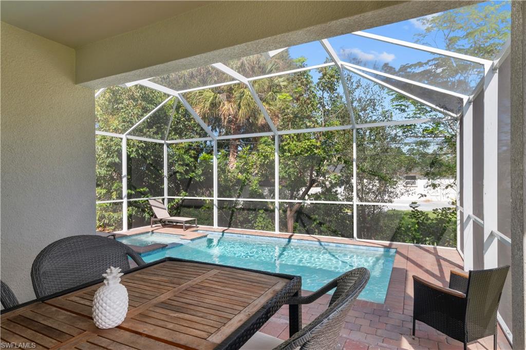 Swimming pool featuring a patio and a lanai