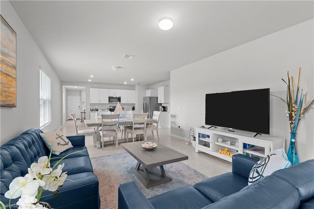 Living area featuring recessed lighting and baseboards
