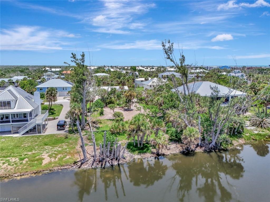 Aerial perspective of suburban area with a nearby body of water