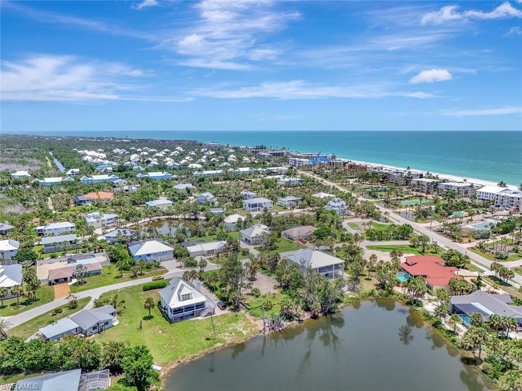 Aerial view of residential area featuring a large body of water