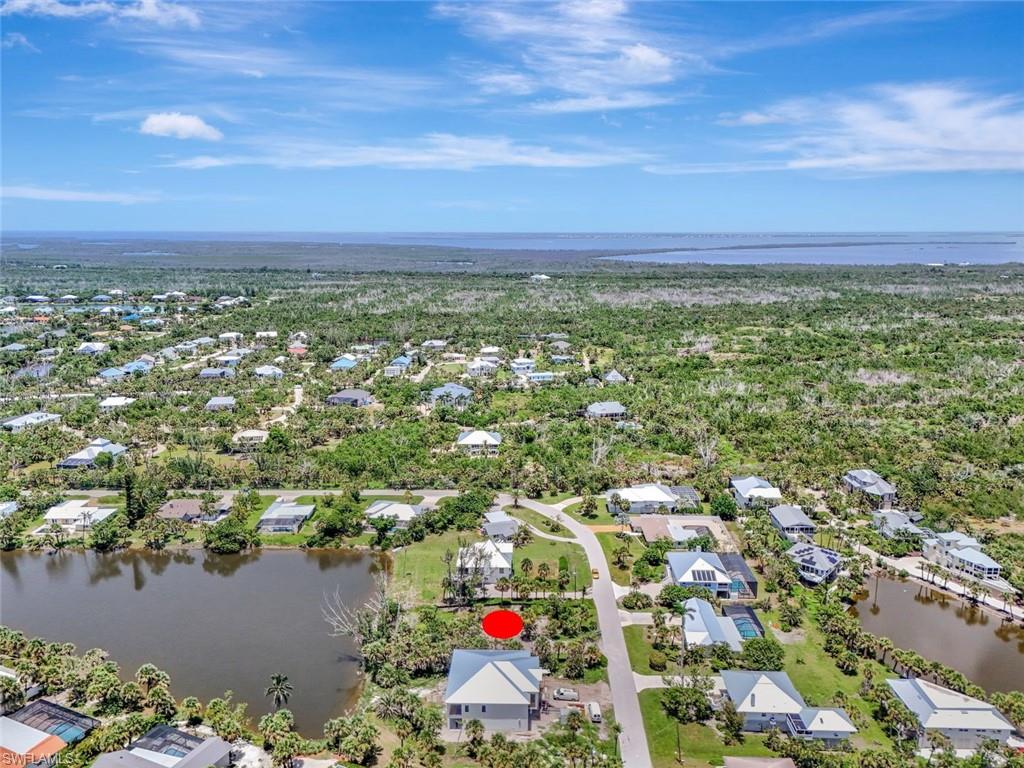 Aerial perspective of suburban area with a nearby body of water