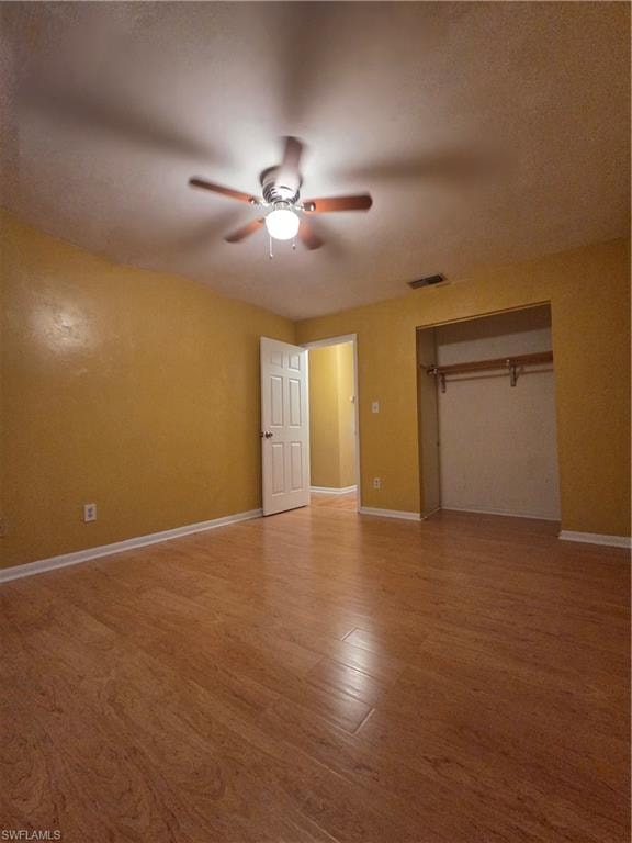 Master bedroom featuring wood finished floors and ceiling fan