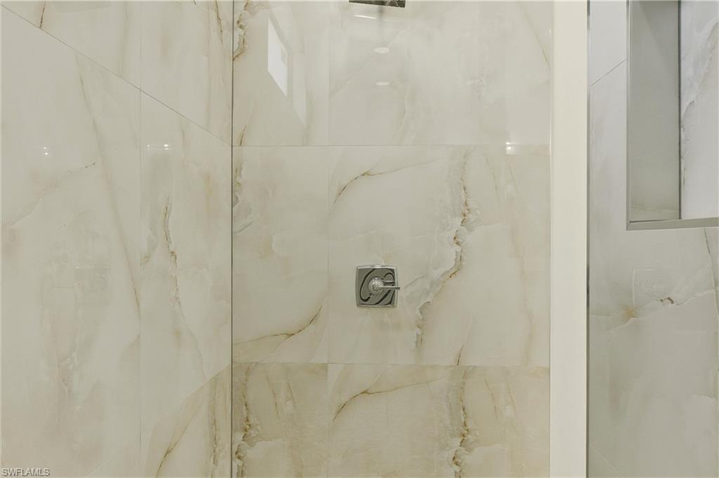 Bathroom view of a marble finish shower