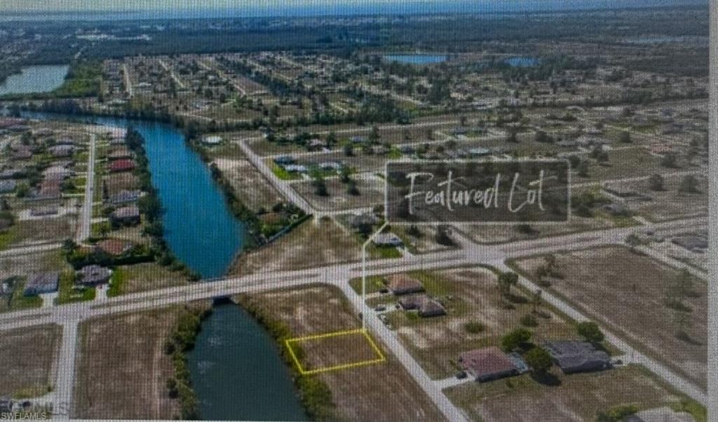 Aerial overview of property's location with property boundaries highlighted and a large body of water