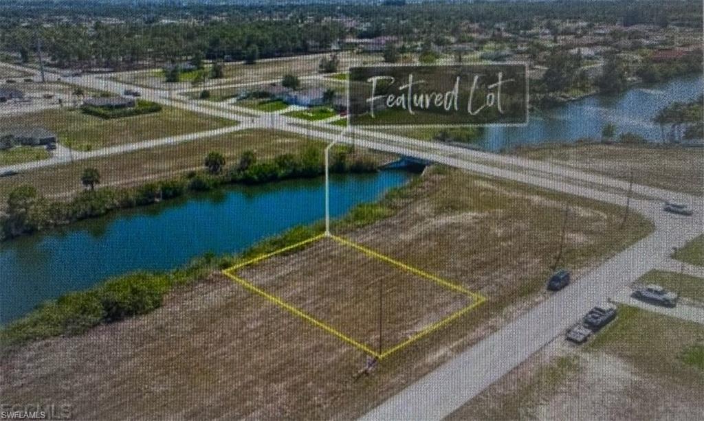 View of property location featuring a nearby body of water and property boundaries highlighted