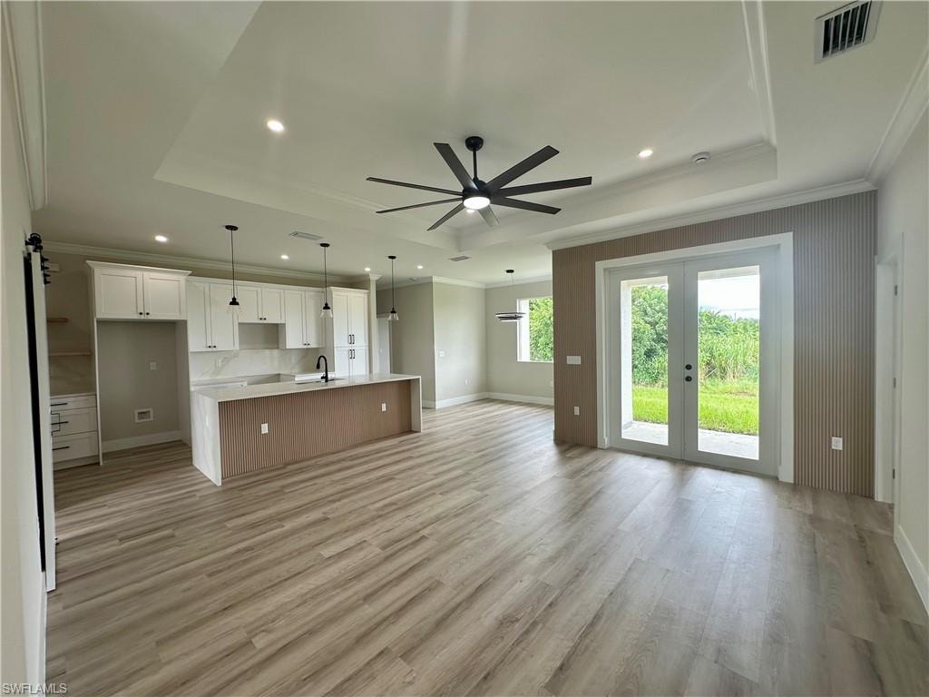 Den/Office Living area with wood finished floors, an office area, and ceiling fan. Pictures virtually staged for illustrative purposes only