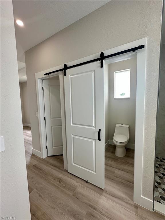 Spare room featuring ornamental molding and light wood-style flooring