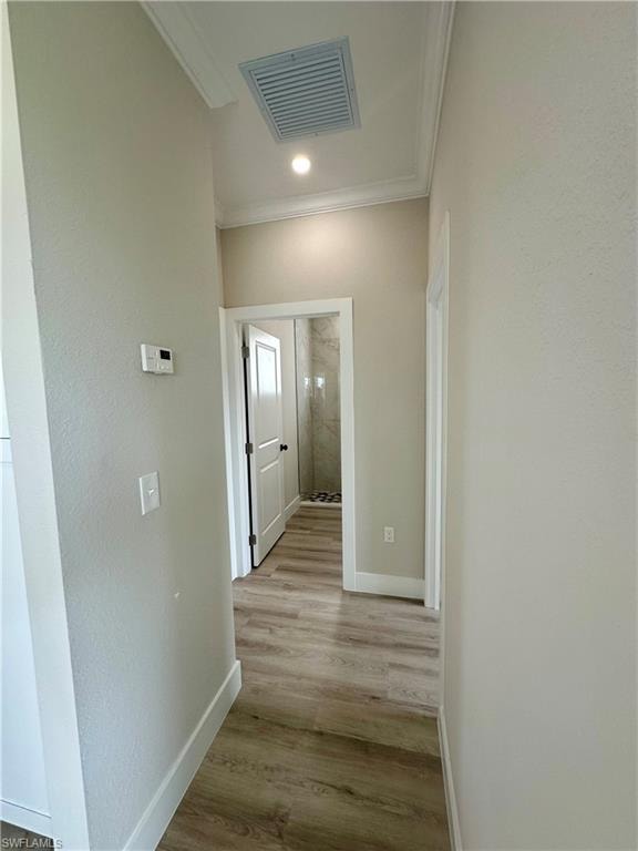 Empty room featuring light wood-style flooring and a ceiling fan