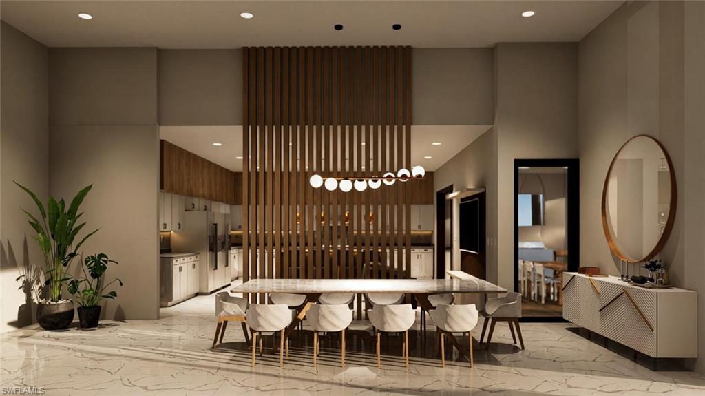 Common area featuring recessed lighting and a towering ceiling