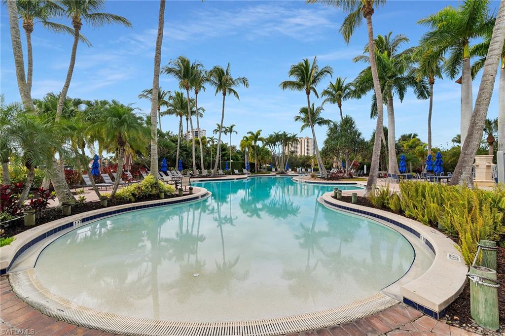 Community pool featuring a patio