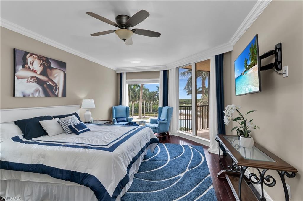 Bedroom with ornamental molding, wood finished floors, floor to ceiling windows, access to exterior, and ceiling fan