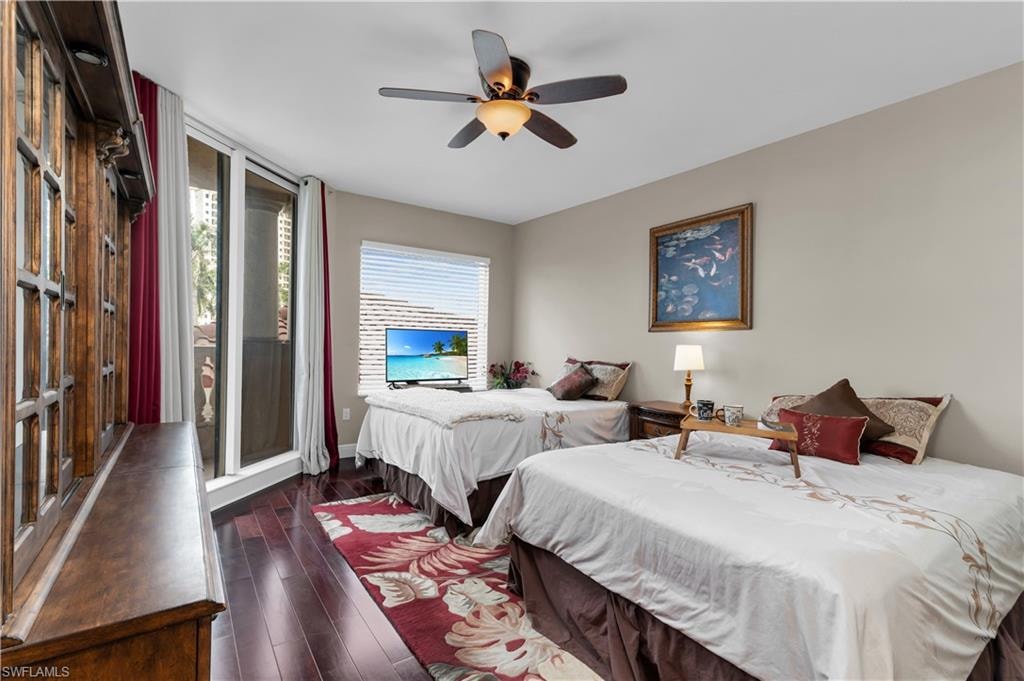 Bedroom featuring hardwood / wood-style floors and a ceiling fan