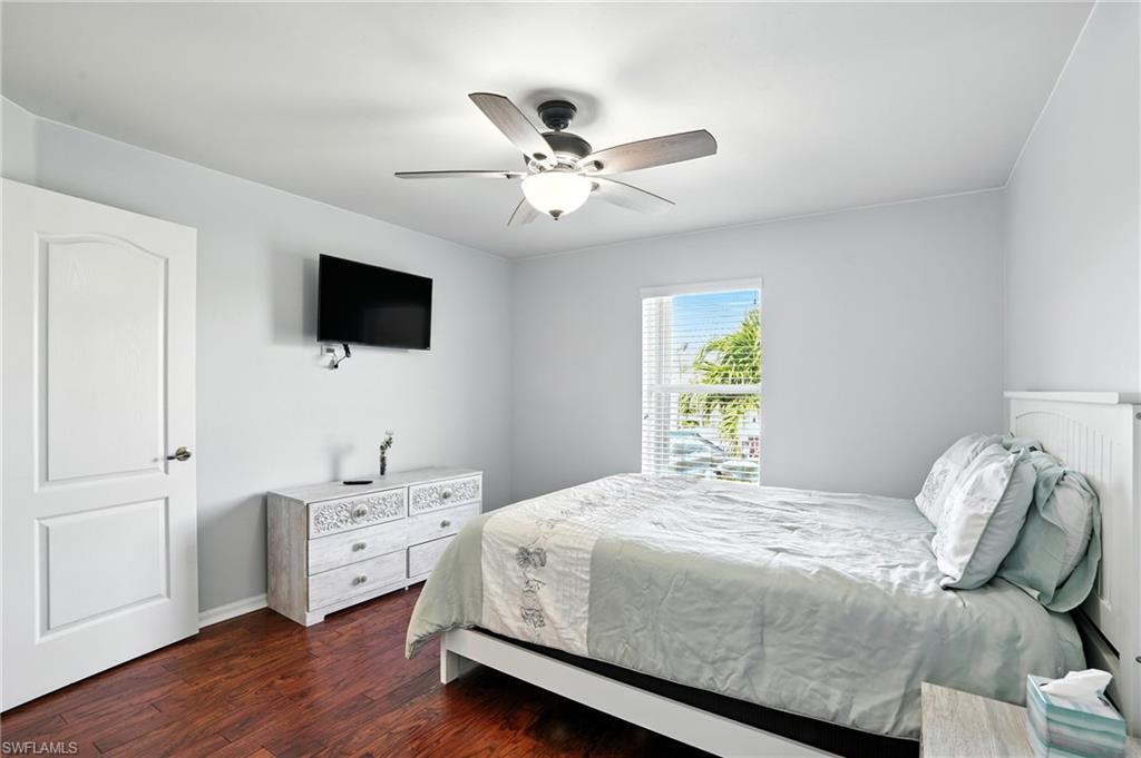 Bedroom with walk in closet and ceiling fan