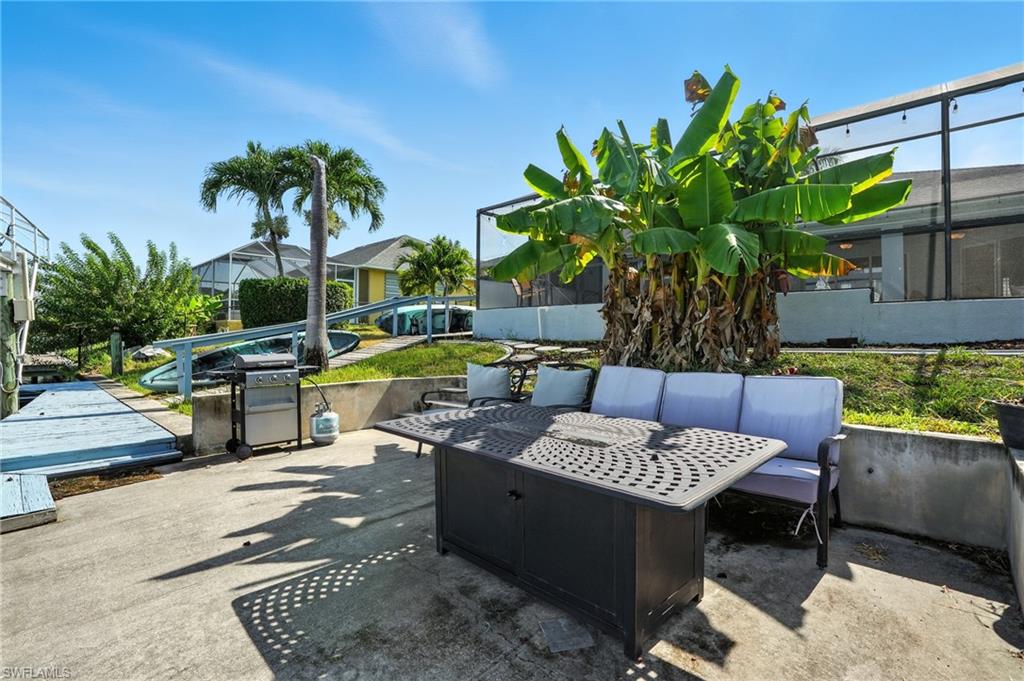 View of concrete dock and firepit
