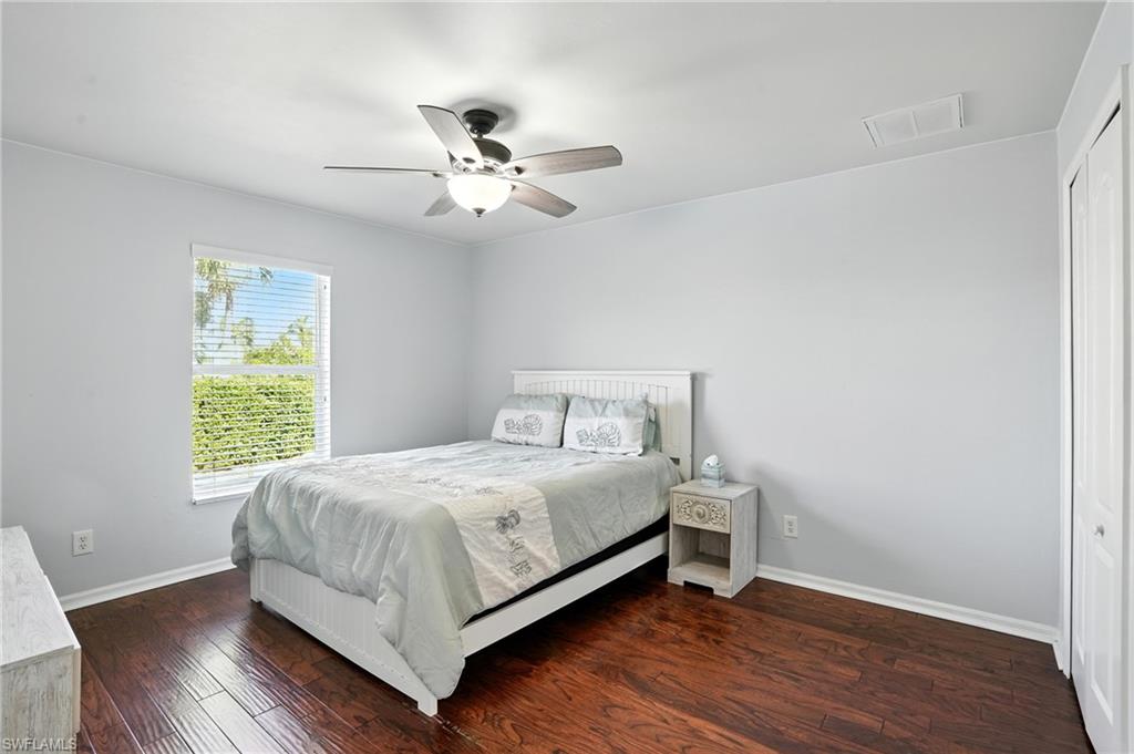 Bedroom with walk in closet and ceiling fan