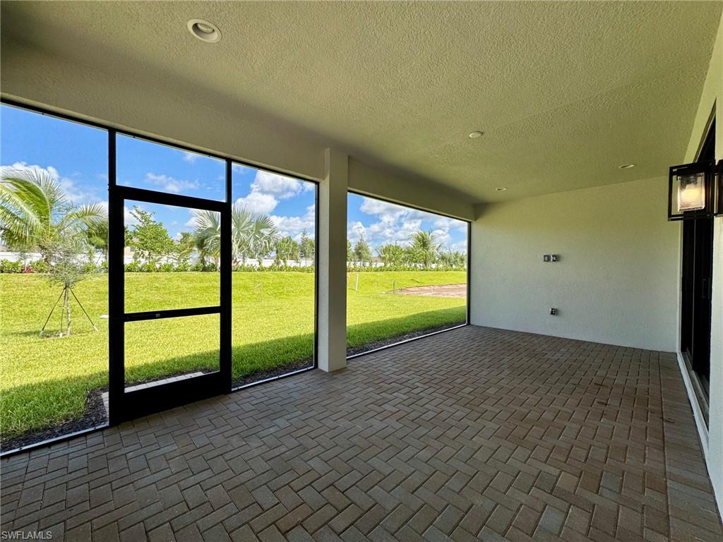 Unfurnished sunroom with a patio