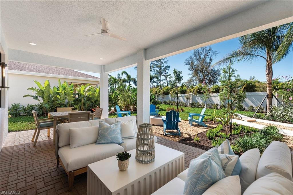 Fenced backyard featuring outdoor lounge area, outdoor dining area, a patio, and a ceiling fan